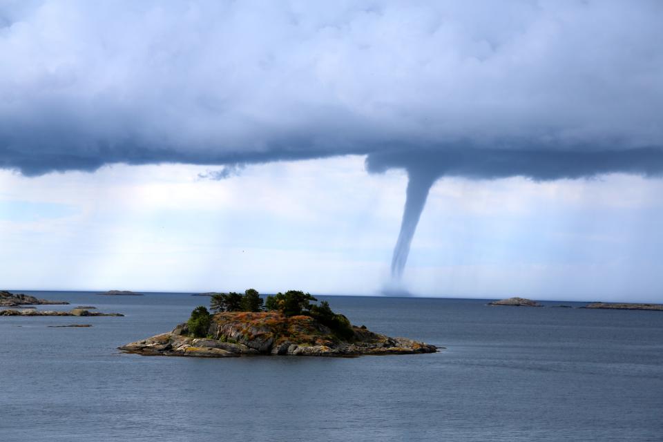 A water spout is seen off the coast of Arendal, Norway.