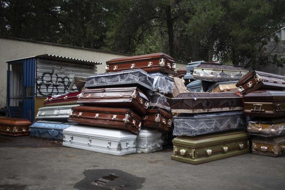 MEXICO CITY, MEXICO - MAY 7: Empty coffins from COVID-19 victims are stocked inside the Xilotepec cemetery in Xochimilco as they await its destruction on May 7, 2020 in Mexico City, Mexico. Mexico is on Stage Three of health emergency, as deaths and positive cases grow. According to Health Ministry, Mexico faces the most dangerous week with an exponential spread of contagion. While only essential activities are permitted, government suggests population to stay at home but quarantine is not obligatory as there is major concern about the economic activity. Social distancing measures could be over between May 18 and 30. (Photo by Cristopher Rogel Blanquet/Getty Images)