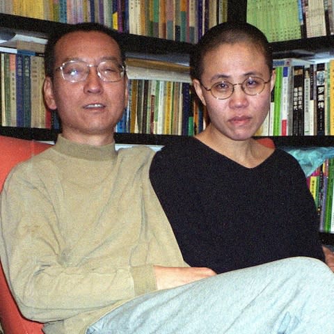 Liu Xia pictured with her husband, Liu Xiabo, in 2002  - Credit: AFP