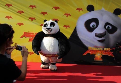 The Panda poses for photographers as it arrives for the premiere of the film "Kung Fu Panda 2" in Berlin on June 7, 2011. DreamWorks Animation, creators of Kung Fu Panda, on Tuesday said it plans to build a $3.2 billion "entertainment zone" in Shanghai, as the US film giant seeks to bolster its presence in the booming Chinese market