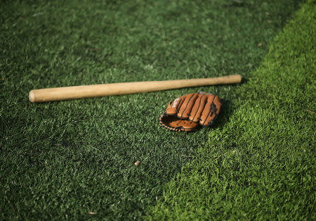 A makeshift bat and a glove are seen during baseball training session for women in Khan Younis in the southern Gaza Strip March 19, 2017. REUTERS/Mohammed Salem