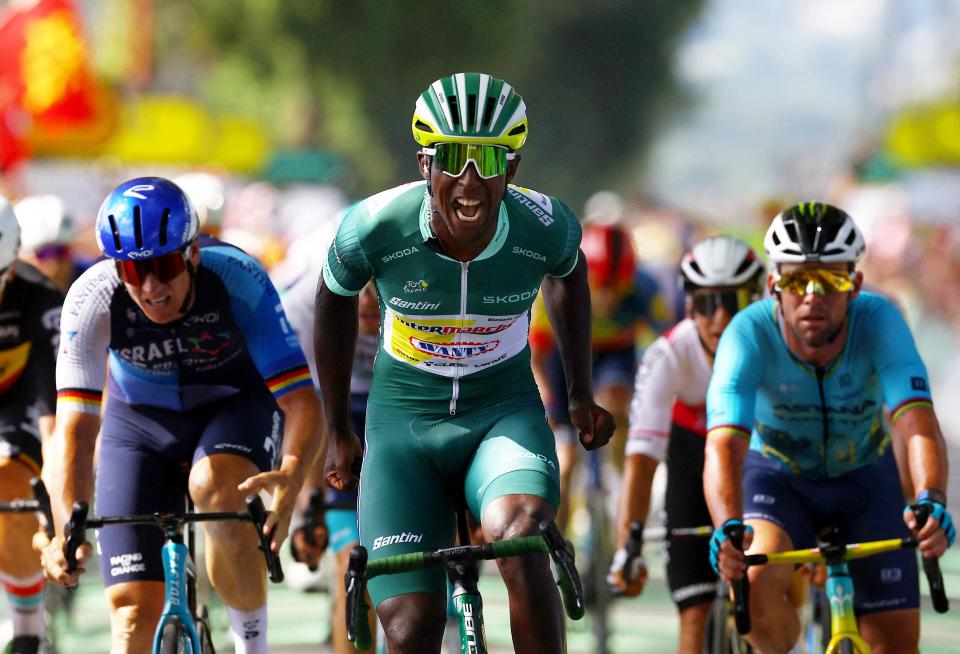 Biniam Girmay celebrates winning Stage 12 of the Tour de France as he crosses the finish line first in Villeneuve-sur-Lot.