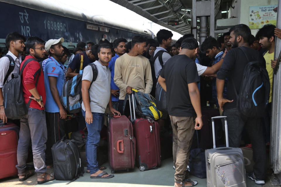 National Institute of Technology (NIT) students who left Srinagar, Kashmir's main city wait to leave for their respective homes at the railway station in Jammu, India, Sunday, Aug. 4, 2019. Thousands of Indian students and visitors were fleeing Indian-controlled Kashmir over the weekend after the government ordered tourists and Hindu pilgrims visiting a Himalayan cave shrine "to curtail their stay" in the disputed territory, citing security concerns. (AP Photo/Channi Anand)