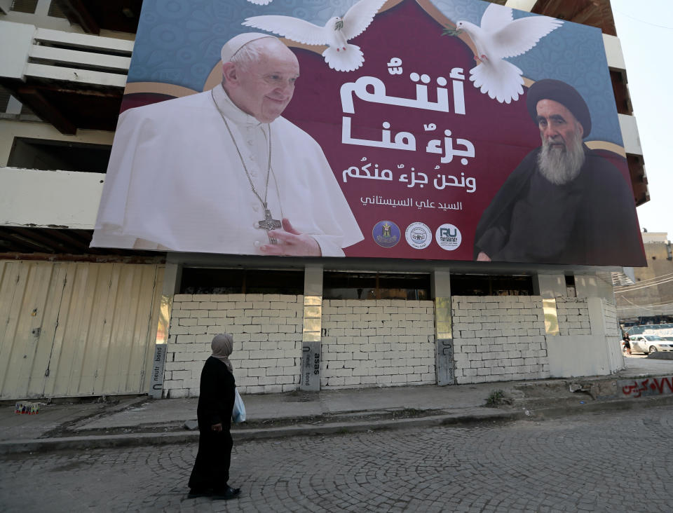 A billboard showing Pope Francis and Grand Ayatollah Ali al-Sistani, with Arabic that reads, "You are a part of us and we are a part of you," hangs on a street in Baghdad, Iraq, prior to the upcoming Pope visit, Monday, March 1, 2021. (AP/Photo/Khalid Mohammed)