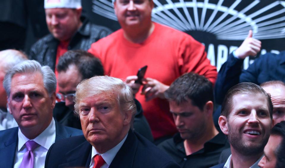 US President Donald Trump (C), his son Eric Trump (R) and House Minority Leader Kevin McCarthy (L) watch the Ultimate Fighting Championship at Madison Square Garden in New York City, New York on November 2, 2019. (Photo by Andrew Caballero-reynolds / AFP) / The erroneous mention[s] appearing in the metadata of this photo by Andrew Caballero-reynolds has been modified in AFP systems in the following manner: [House Minority Leader Kevin McCarthy] instead of [Republican US representative for North Carolina Mark Meadows]. Please immediately remove the erroneous mention[s] from all your online services and delete it (them) from your servers. If you have been authorized by AFP to distribute it (them) to third parties, please ensure that the same actions are carried out by them. Failure to promptly comply with these instructions will entail liability on your part for any continued or post notification usage. Therefore we thank you very much for all your attention and prompt action. We are sorry for the inconvenience this notification may cause and remain at your disposal for any further information you may require. (Photo by ANDREW CABALLERO-REYNOLDS/AFP via Getty Images)