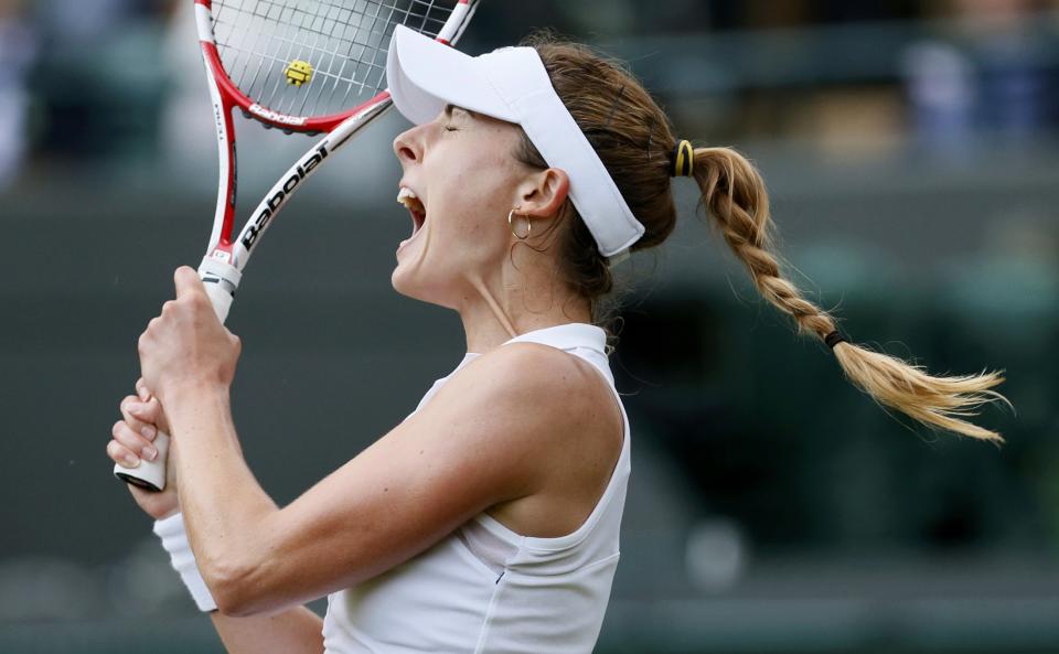 Alize Cornet of France reacts during her women's singles tennis match against Serena Williams of the U.S. at the Wimbledon Tennis Championships, in London June 28, 2014. REUTERS/Stefan Wermuth (BRITAIN - Tags: SPORT TENNIS TPX IMAGES OF THE DAY)