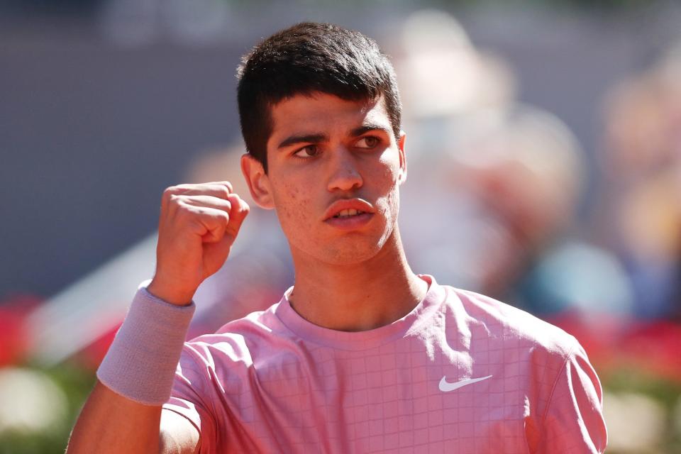 Carlos Alcaraz of Spain celebrates a point during his second round match against Rafael Nadal of Spain during day seven of the Mutua Madrid Open