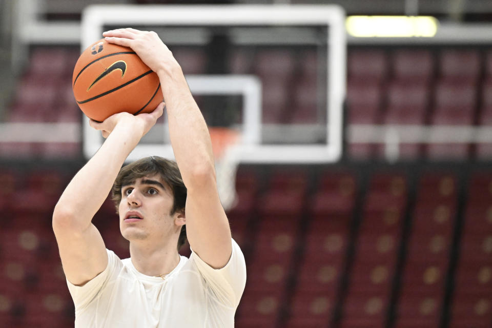 Stanford forward Maxime Raynaud warms up before an NCAA college basketball game against Oregon Thursday, Feb. 22, 2024, in Stanford, Calif. (AP Photo/Nic Coury)