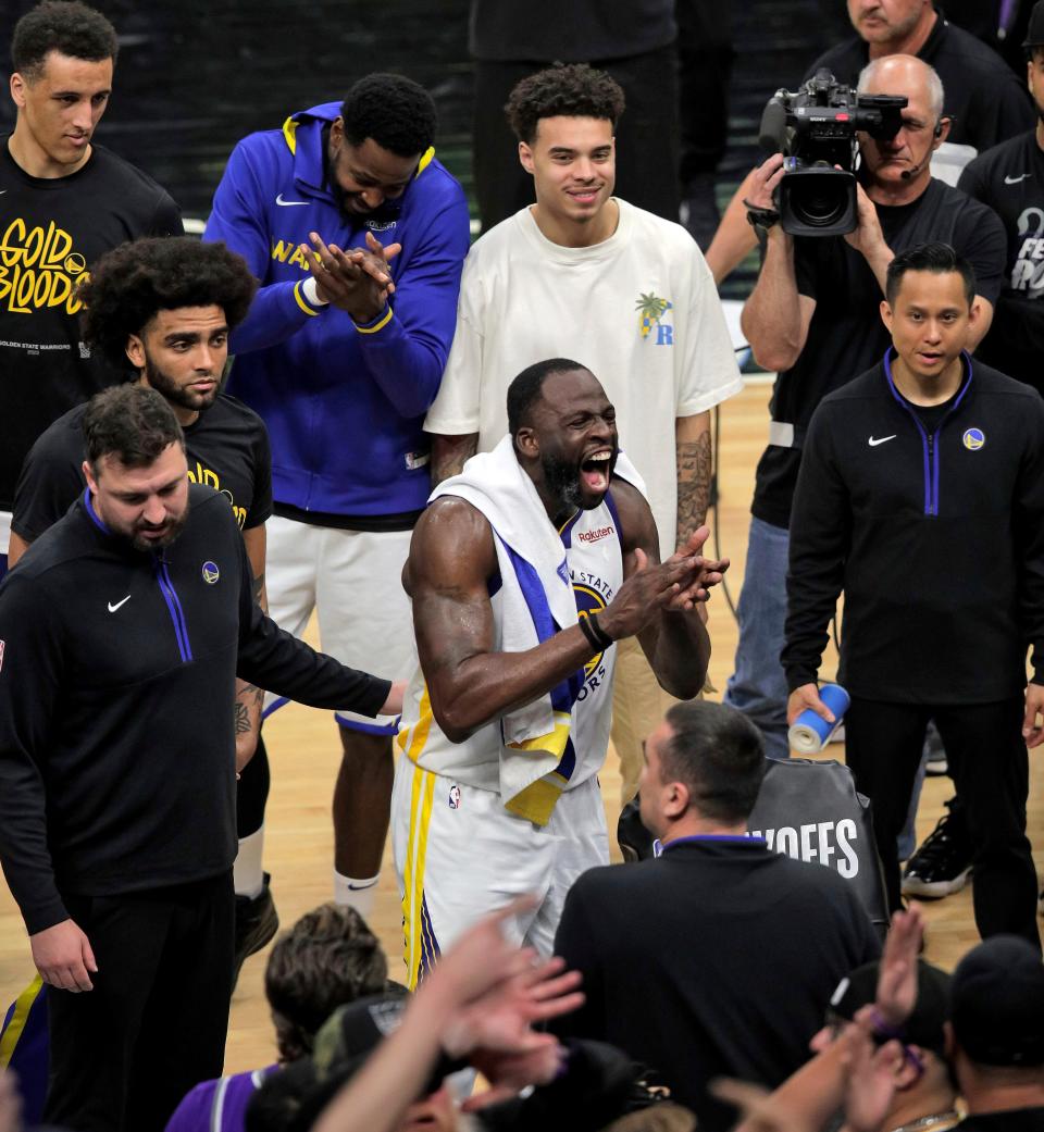 Golden State's Draymond Green reacts before he was ejected from the game after stomping on the chest of Sacramento's Domantas Sabonis.