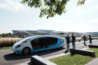 The solar-powered vehicle is on display on a closed road, in Guyancourt, south of Paris, Friday Sept. 24, 2021. A group of Dutch students has reimagined van life and is hitting the road to Portugal. Just don't call their groundbreaking new solar-powered vehicle a campervan. (AP Photo/Thibault Camus)