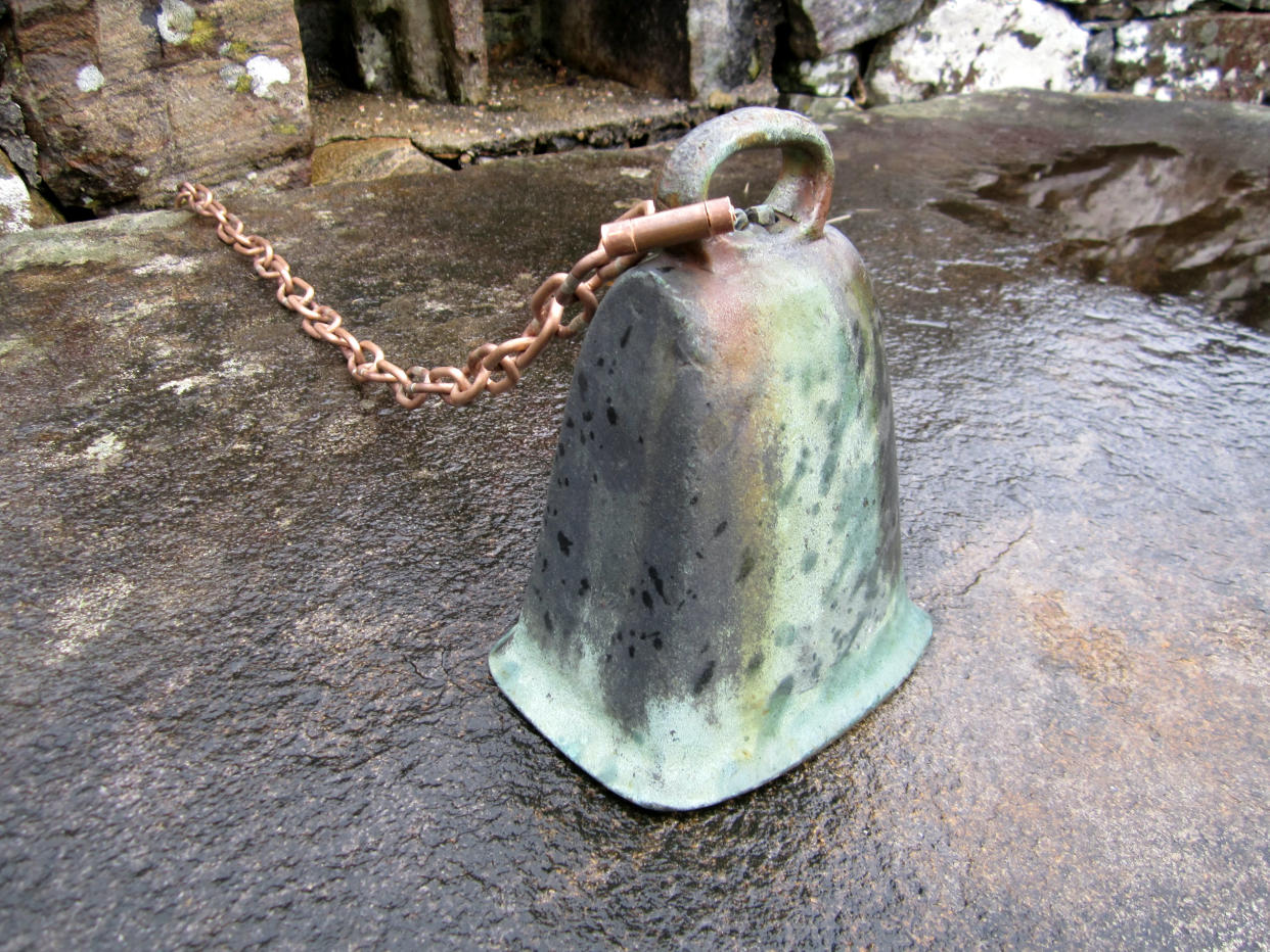 The stolen bell. See SWNS story SWSCbell. Thieves who stole a priceless medieval bell from a remote island which featured in the Harry Potter films may have unwittingly put a CURSE on themselves, historians warned. The tiny island, St Finans Isle, in Loch Shiel, near Fort William, Scottish Highlands, has been a burial ground since 661 AD and was the setting for the Black Lake in the Harry Potter film series. Until four years ago it was barely visited by tourists, but in recent years kayakers have begun to visit in droves. Apart from graves, there is just a roofless chapel on the island, with the alter stone holding a bell dating back more than 1,000 years.