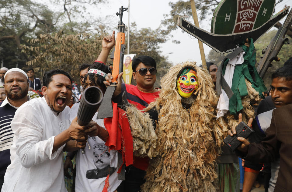 Supporters of the Awami League political party play with toy guns during a rally celebrating the party's overwhelming victory in last month's election in Dhaka, Bangladesh, Saturday, Jan. 19, 2019. (AP Photo)