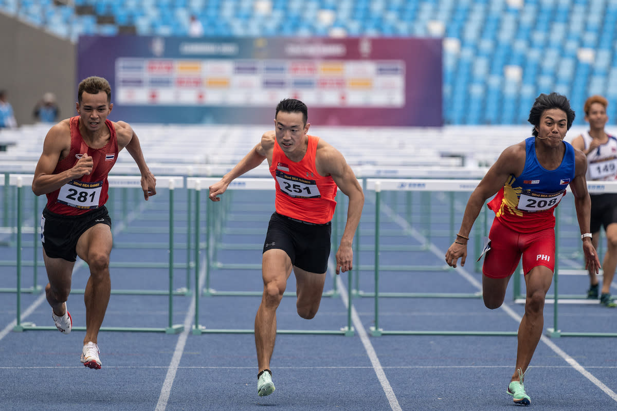 Singapore hurdler Ang Chen Xiang (centre) wins joint-gold with Thailand's Natthaphon Dansungnoen (left) in the men's 110m hurdles at the 2023 SEA Games.