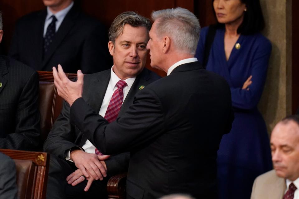 Rep. Kevin McCarthy, R-Calif., right, talks with Rep. Andy Ogles, R-Tenn., during the eighth round of voting in the House chamber as the House meets for the third day to elect a speaker and convene the 118th Congress in Washington, Thursday, Jan. 5, 2023. (AP Photo/Alex Brandon)