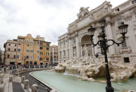 FILE - In this file photo dated Wednesday, May 2, 2018, the Trevi Fountain is cordoned-off hours before the Champions League semifinal second leg soccer match between Liverpool and Roma, in Rome, Italy. The recent devastating Notre Dame fire in Paris was a warning bell that all of Europe needs to hear since so many monuments and palaces across the continent are in need of better upkeep. National governments are increasingly looking for private donors to renovate major monuments prompting Fendi fashion house to help renovate the Trevi Fountain. (AP Photo/Riccardo De Luca, FILE)