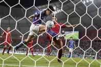 Japan's Ao Tanaka scores his side's second goal during the World Cup group E soccer match between Japan and Spain, at the Khalifa International Stadium in Doha, Qatar, Thursday, Dec. 1, 2022. (AP Photo/Darko Vojinovic)