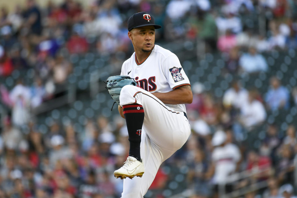 Minnesota Twins pitcher Chris Archer winds up to throw against the Colorado Rockies during the first inning of a baseball game, Saturday, June 25, 2022, in Minneapolis. (AP Photo/Craig Lassig)