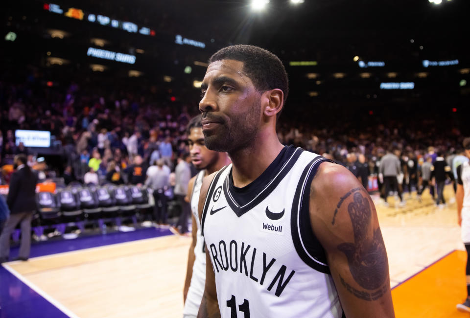 Jan 19, 2023; Phoenix, Arizona, USA; Brooklyn Nets guard Kyrie Irving (11) reacts against the Phoenix Suns in the first half at Footprint Center. Mandatory Credit: Mark J. Rebilas-USA TODAY Sports