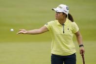 Nasa Hataoka tosses a ball to her caddie on the first green during the third round of the LPGA Cognizant Founders Cup golf tournament, Saturday, May 14, 2022, at the Upper Montclair Country Club in Clifton, N.J. (AP Photo/John Minchillo)