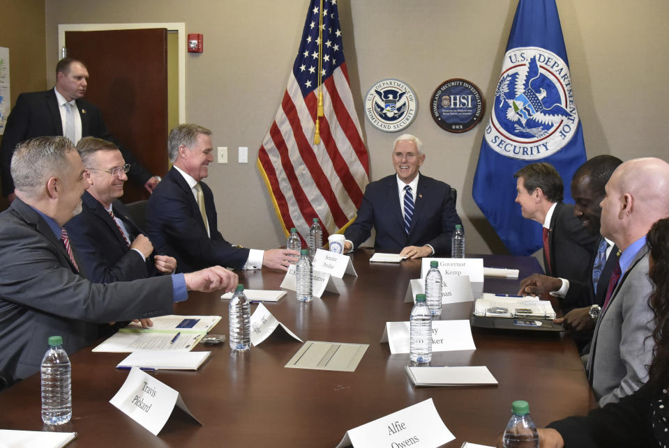 Vice President Mike Pence smiles as he talks with ICE top officials before he receives a briefing at Homeland Security Investigation Principal Field Offices in Atlanta on Thursday, March 21, 2019. (Hyosub Shin/Atlanta Journal-Constitution via AP, Pool)