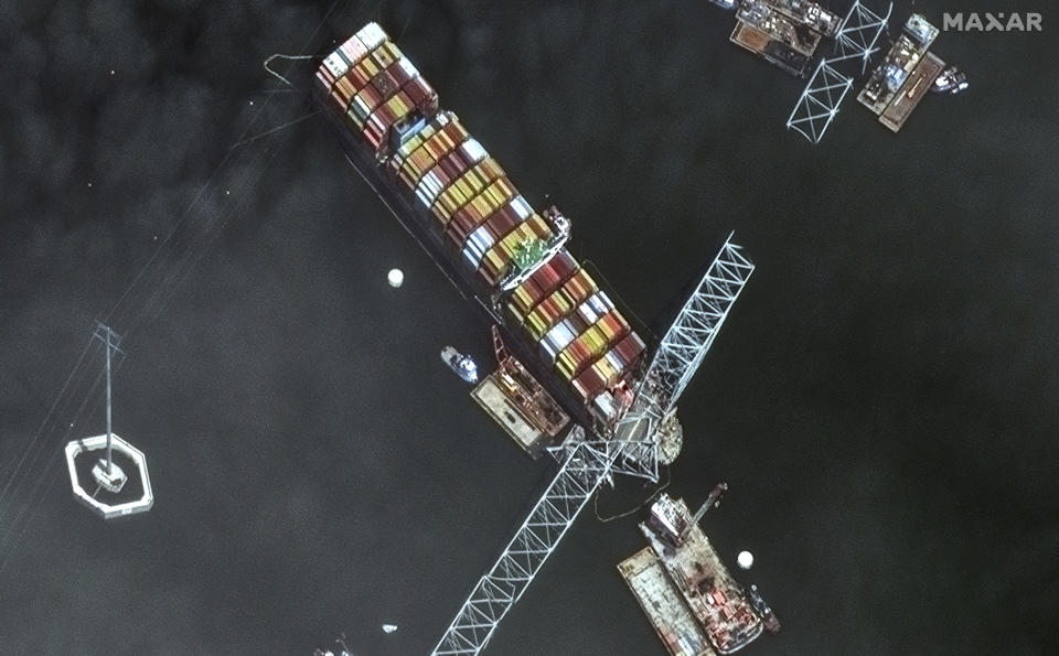 FILE - This satellite image provided by Maxar shows the bow of the container ship Dali remains stuck underneath sections of the fallen Francis Scott Key Bridge, in Baltimore, April 8, 2024. The FBI is conducting a criminal investigation into the deadly collapse of Baltimore’s Francis Scott Key Bridge that is focused on the circumstances leading up to it and whether all federal laws were followed. The FBI says Monday, April 15 it was present conducting court authorized law enforcement activity. (Satellite image ©2024 Maxar Technologies via AP, file)