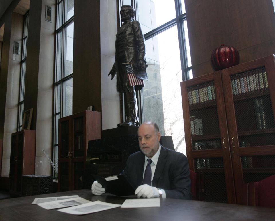 Mark Patrick, the former coordinator for special collections of the Burton Historical Collection at the Detroit Public Library, reads some of the President Lincoln documents, including a letter from an eleven-year-old girl to President Abraham Lincoln in 1860, that inspired the President to grow a beard. "I remember learning about that letter in Mrs. Wilson's class in fourth or fifth grade," he said. Archive photo 2007