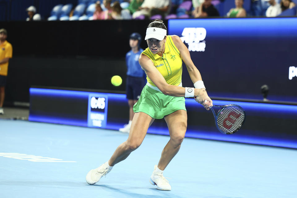 Ajla Tomljanovic of Australia plays a forehand shot to Katie Boulter of Great Britain during the United Cup tennis tournament in Perth, Australia, Friday, Dec. 29, 2023. (AP Photo/Trevor Collens)