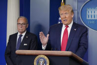 President Donald Trump speaks during a news briefing at the White House, Thursday, July 2, 2020, in Washington, as White House chief economic adviser Larry Kudlow looks on. (AP Photo/Evan Vucci)