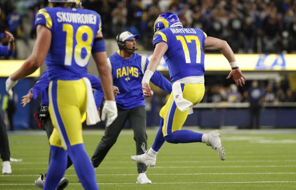 Rams quarterback Baker Mayfield leaps in celebration after throwing the deciding touchdown pass to beat the Raiders.