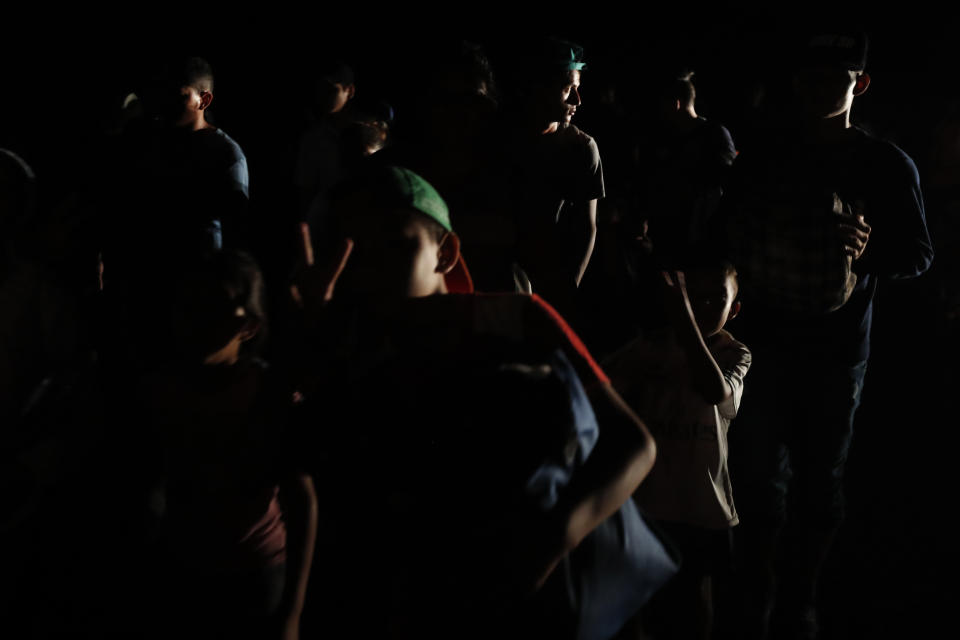 Central American migrants traveling with a caravan to the U.S. make their way to Mapastepec, Mexico, Wednesday, Oct. 24, 2018. After a day of rest to honor a fellow traveler who died on the road on Monday, the march continues through Mexico. (AP Photo/Moises Castillo)