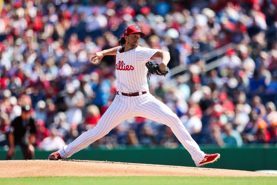 Philadelphia Phillies starting pitcher Aaron Nola (27) throws a pitch against the New York Yankees in the first inning at BayCare Ballpark.