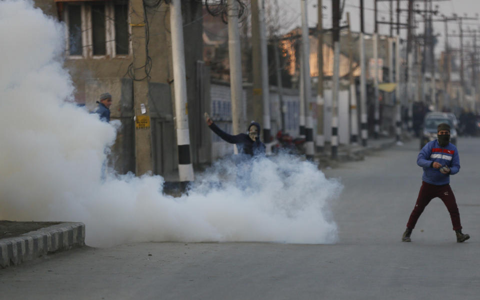 Kashmiri protesters clash with Indian paramilitary soldiers in Srinagar, Indian controlled Kashmir, Saturday, Dec. 15, 2018. At least seven civilians were killed and nearly two dozens injured when government forces fired at anti-India protesters in disputed Kashmir following a gunbattle that left three rebels and a soldier dead on Saturday, police and residents said. (AP Photo/Mukhtar Khan)