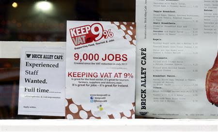 A campaign poster calling for the retention of the 9% VAT rate for the hospitality sector is displayed in a Dublin city centre cafe ahead of Ireland's budget later this month, October 4, 2013. REUTERS/Cathal McNaughton