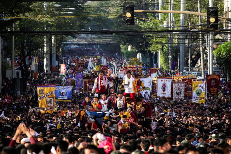 Filipino devotees join the annual Catholic procession of the Black Nazarene during its feast day in Manila