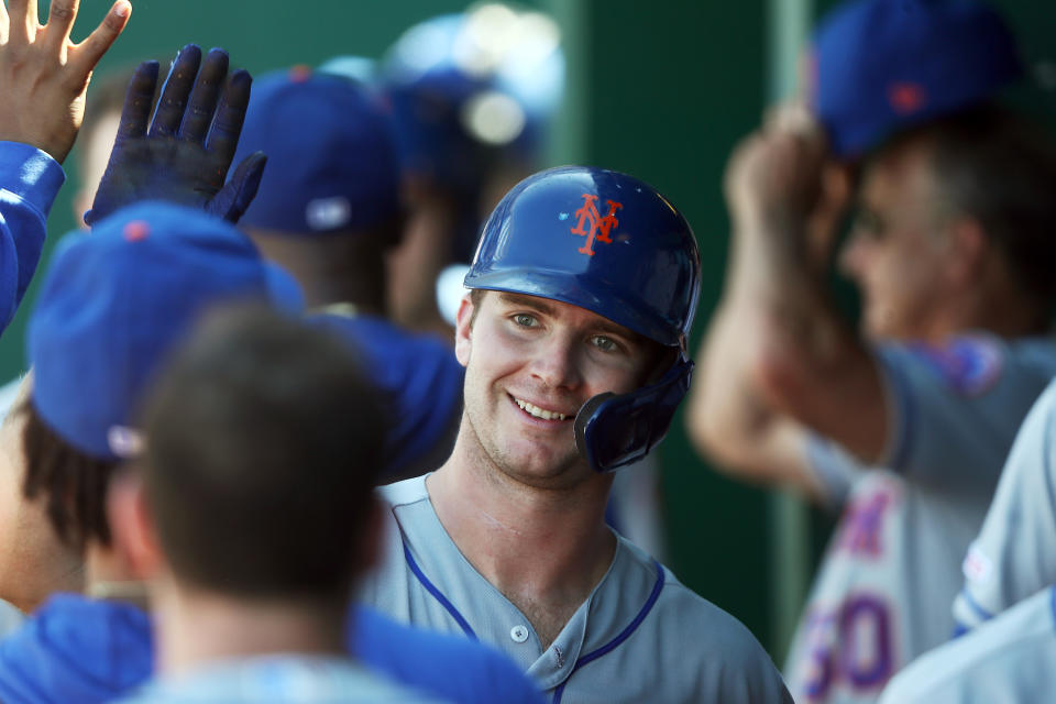 KANSAS CITY, MISSOURI - AUGUST 18:  Pete Alonso #20 of the New York Mets is congratulated by teammates in the dugout after hitting a home run during the 8th inning of the game against the Kansas City Royals at Kauffman Stadium on August 18, 2019 in Kansas City, Missouri. (Photo by Jamie Squire/Getty Images)