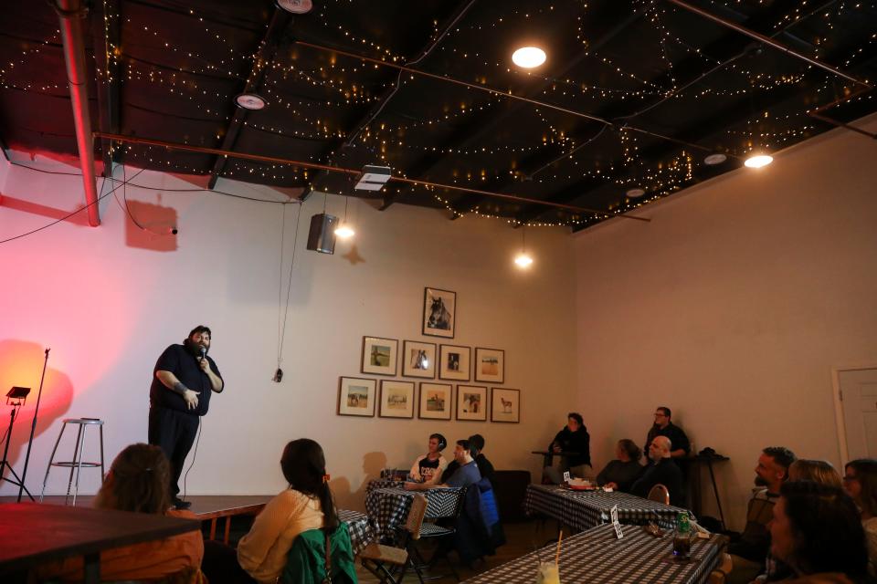Comedians perform on Divine Distillers' stage in Independence in January.