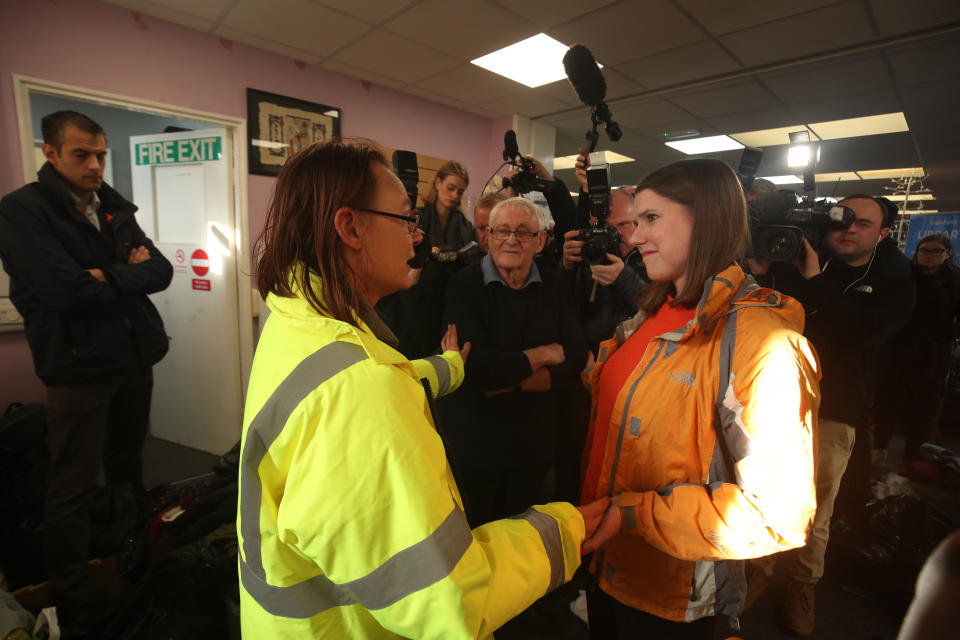 Liberal Democrats leader Jo Swinson speaks to volunteer Rosie Squires in the Stainforth 4 All charity shop during a visit to Stainforth in South Yorkshire to meet people affected by flooding.