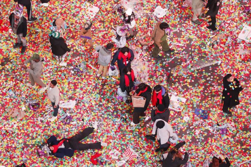 Streets are covered in confetti in Times Square during the New Year's Eve celebrations in New York City on Monday. Photo by John Angelillo/UPI