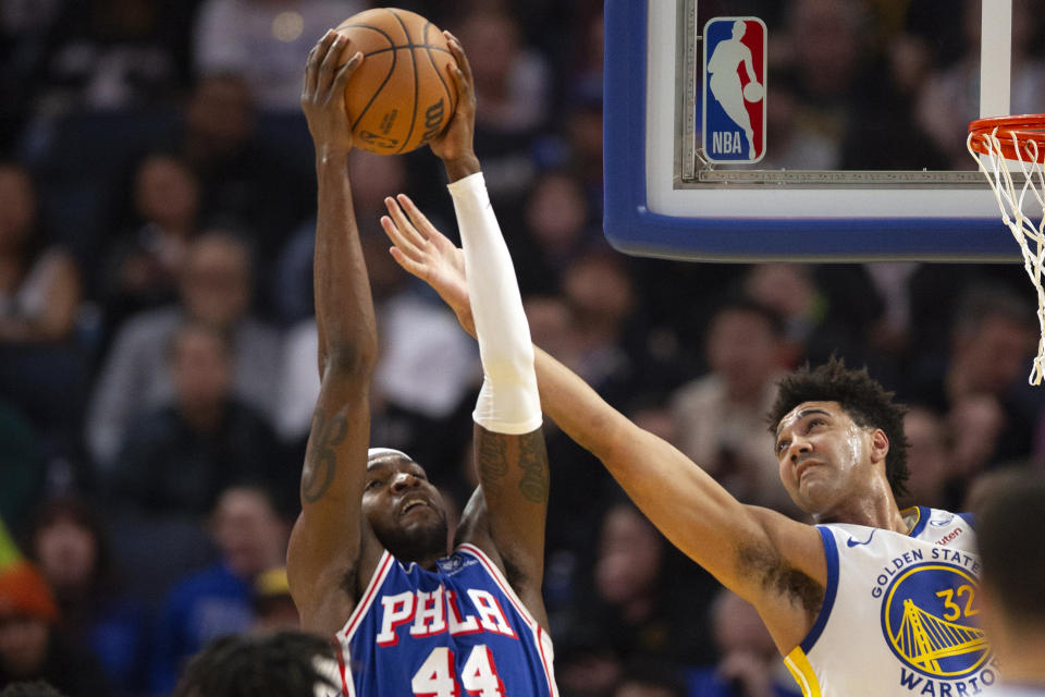 Philadelphia 76ers forward Paul Reed (44) and Golden State Warriors forward Trayce Jackson-Davis (32) vie for a rebound during the first half of an NBA basketball game, Tuesday, Jan. 30, 2024, in San Francisco. (AP Photo/D. Ross Cameron)