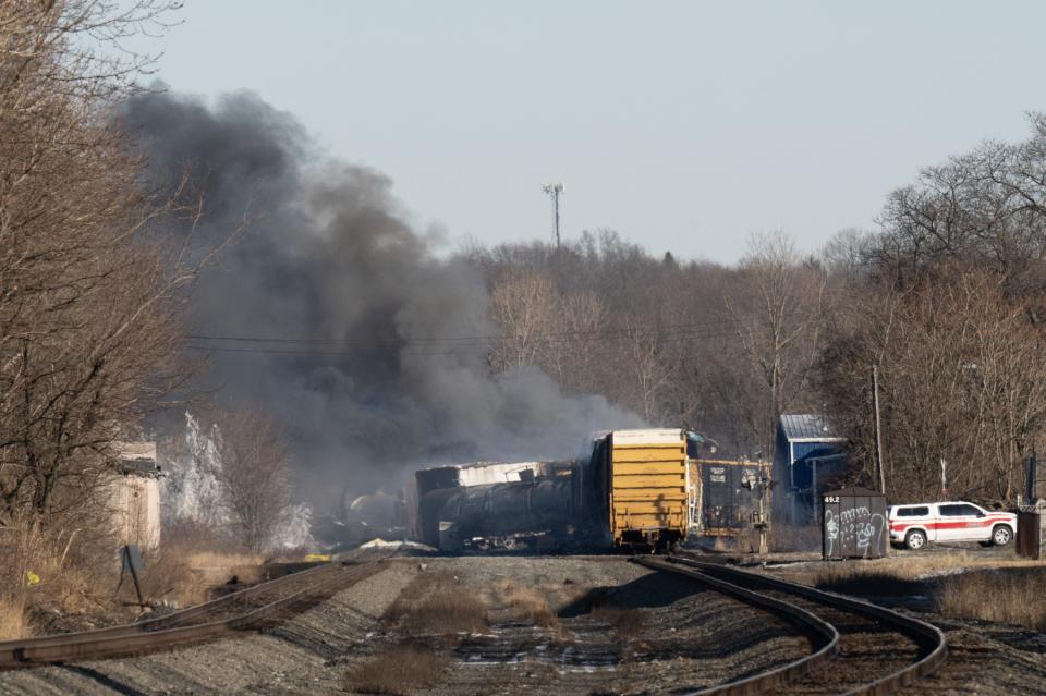 In this photo taken on February 04, 2023 smoke rises from a derailed cargo train in East Palestine, Ohio, on February 4, 2023. - The US government ordered the Norfolk Southern railroad company on Feb. 21, 2023 to pay the entire cost of the cleanup of a toxic train derailment in the midwestern state of Ohio.