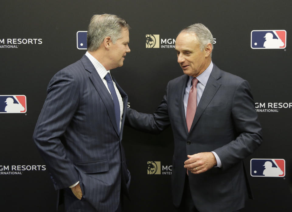 MGM Resorts CEO James Murren, left, and MLB Commissioner Rob Manfred talk after a news conference at MLB headquarters in New York, Tuesday, Nov. 27, 2018. (AP Photo/Seth Wenig)