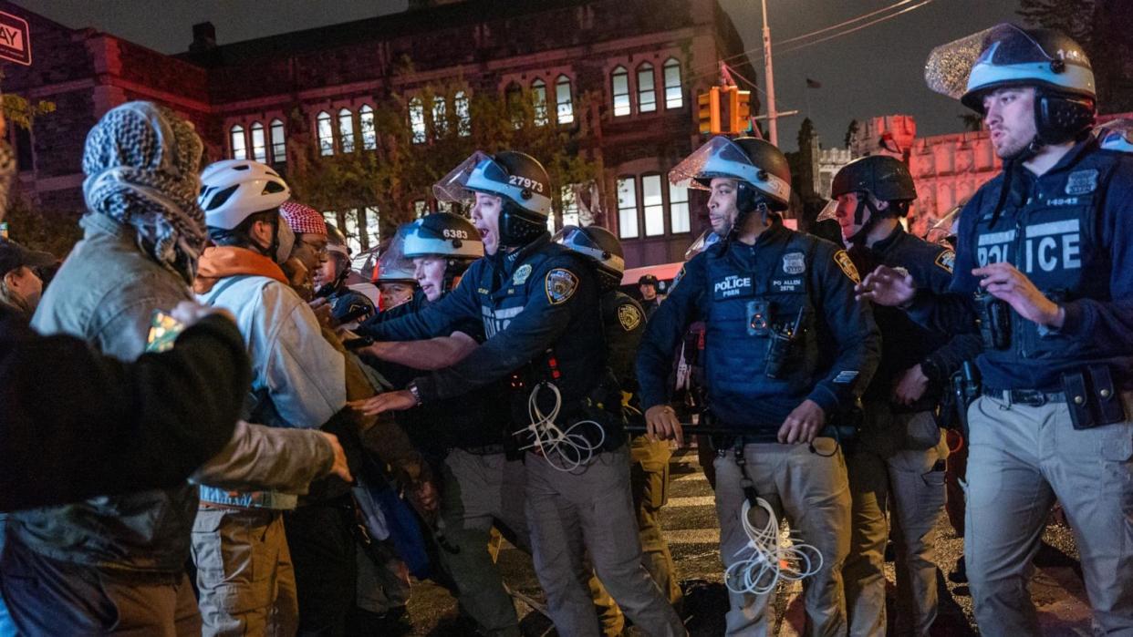 PHOTO: Pro-Palestinian supporters confront police during demonstrations at The City College Of New York (CUNY) as the NYPD cracks down on protest camps at both Columbia University and CCNY on April 30, 2024 in New York City. (Spencer Platt/Getty Images)