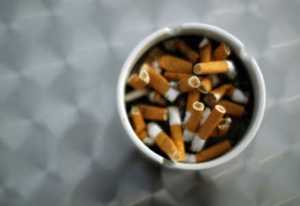 FILE PHOTO: An ash tray with cigarette butts is pictured in Hinzenbach, in the Austrian province of Upper Austria, February 5, 2012.  REUTERS/Lisi Niesner