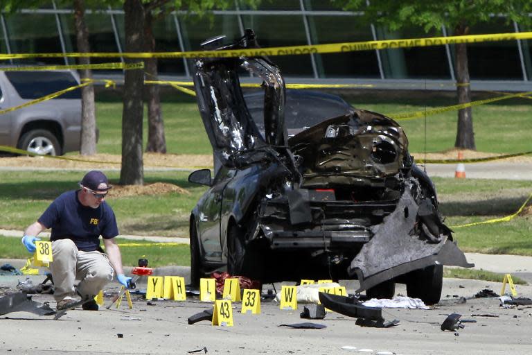 Members of the FBI Evidence Response Team investigate the crime scene outside of the Curtis Culwell Center after a shooting occurred the day before, on May 4, 2015 in Garland, Texas