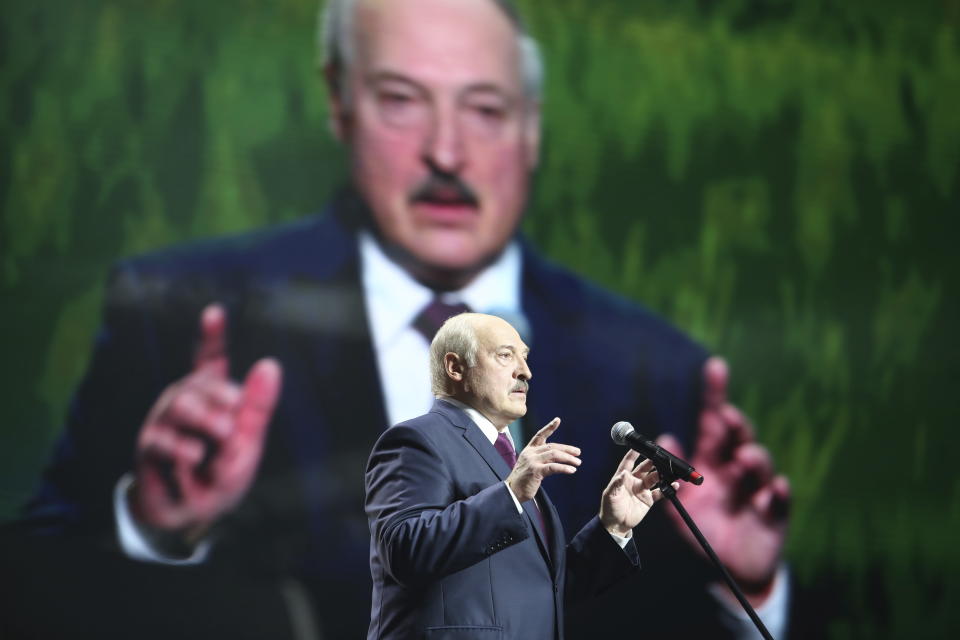 Belarusian President Alexander Lukashenko gestures as he addresses a women's forum in Minsk, Belarus, Thursday, Sept. 17, 2020. President Alexander Lukashenko's decision to close the borders with Poland and Lithuania underlines his repeated claim that the massive wave of protests is driven by the West and comes amid increasing criticism from the United States and the European Union. (TUT.by via AP)