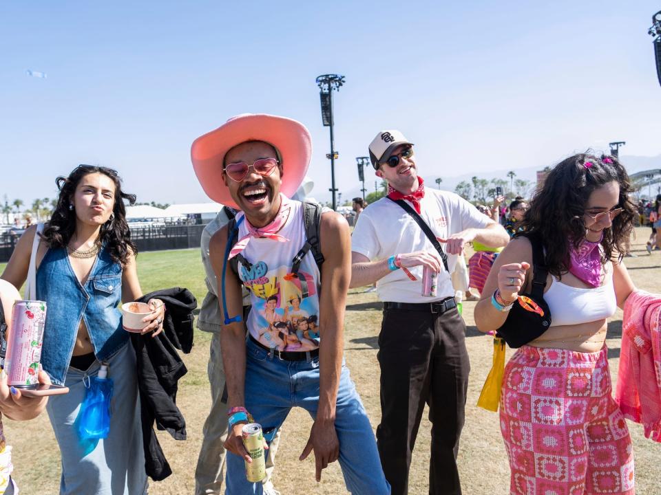 Group walks through Coachella wearing festival fashion