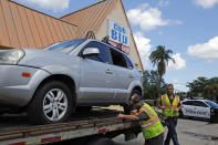 <p><b><br></b>A car hit by gunfire is removed outside of Club Blu where two people were killed and at least 15 wounded on July 25, 2016 in Fort Myers, Florida. (Mike Carlson/Getty Images)</p>