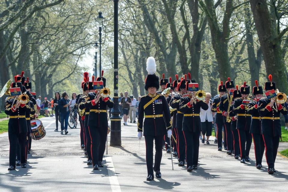 A marching band perform in Hyde Park to mark The Queen's 92nd birthday (EPA)