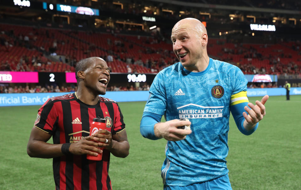 May 8, 2019; Atlanta, GA, USA; Atlanta United midfielder Darlington Nagbe (6) and goalkeeper Brad Guzan (1) celebrates their win against Toronto FC at Mercedes-Benz Stadium. Mandatory Credit: Jason Getz-USA TODAY Sports