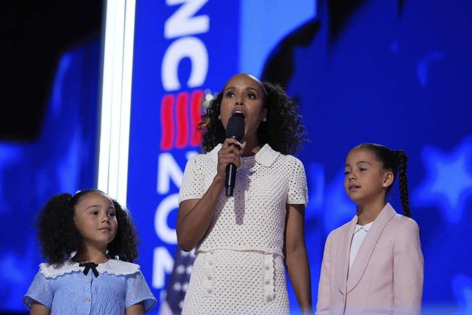 Kerry Washington, center, with grand-nieces of Democratic presidential nominee Vice President Kamala Harris Amara Ajagu, right, and Leela Ajagu, speak during the Democratic National Convention Thursday, Aug. 22, 2024, in Chicago. (AP Photo/Brynn Anderson)